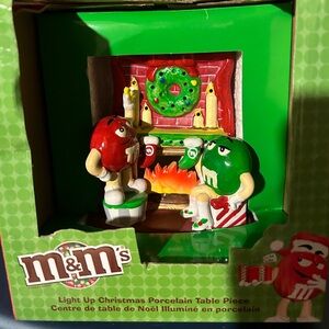 Porcelain M&M Christmas fireplace scene.